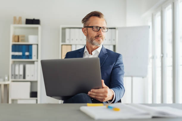istock Serious thoughtful businessman wearing glasses 1248879015