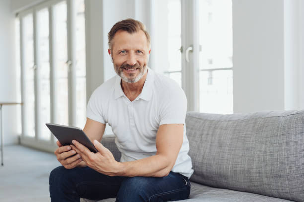 istock Casual middle-aged man relaxing at home 1248879044