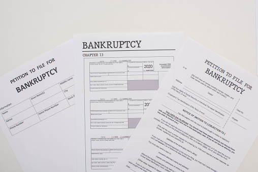top view of bankruptcy petition papers on white background