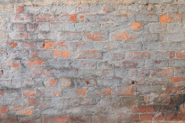 istock Closeup of weathered brick wall texture 1248882538