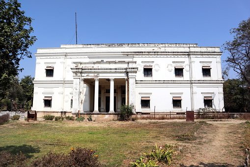 Indore, Madhya Pradesh, India, February 11, 2020 :  The Lal Bagh Palace was built by Maharaja Shivaji Rao Holkar in the year 1886-1921. The beautiful Palace is situated in the outskirts of the Indore city. It is a three storey building standing tall on the banks of the River Khan. The Lal Bagh Palace architecturally resembles the New Palace. The Palace also houses a coin collection which is from the Muslim period.