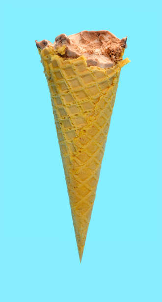 istock side view fresh chocolate flavor ice cream cone with some bites on a blue background 1248884492