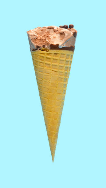 istock side view fresh chocolate flavor ice cream cone with a bite on a blue background 1248884545