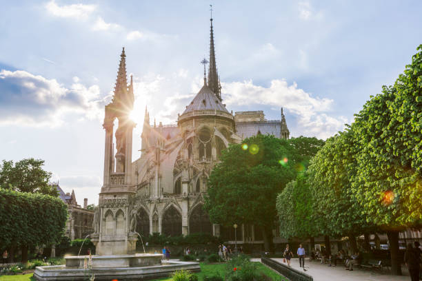 istock Notre Dame rear view with city park in Paris during sunset 1248884565