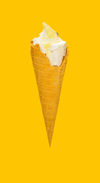 istock side view half eaten vanilla flaovr ice cream cone on a yellow background 1248884984