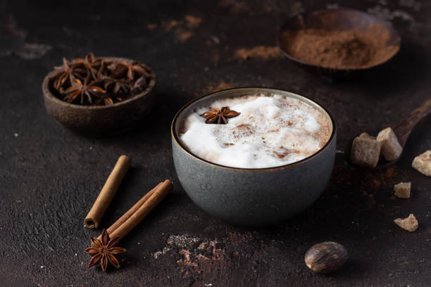 istock Hot chocolate or hot cocoa with anise star and cinnamon sticks over dark texture background. Selective focus. 1248886087