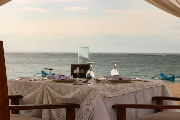 istock Romantic dinner in a tent on the ocean, table setting for two persons 1248886227