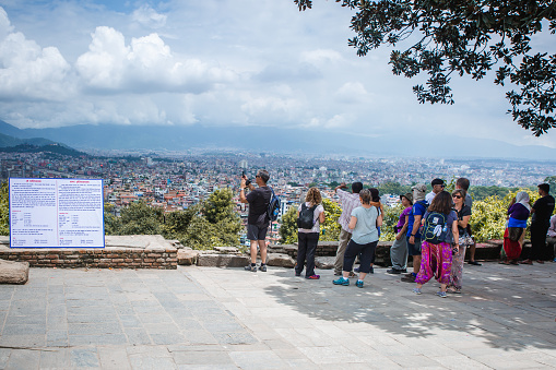 Kathmandu,Nepal - August 15,2019: Many Tourists taking photographs of Kathmandu Valley from Bagh Bhairav Temple in Kritipur.Tourist Travel Destinations In Nepal.