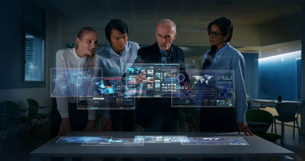 istock A group of designer are using a futuristic sophisticated technology screen with augmented reality holograms for a new worldwide global project realization in an office. 1248887511