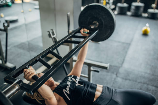 istock One sporty woman weightlifting 1248892145