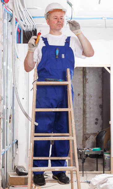 istock Electrician laying electric wires 1248892416