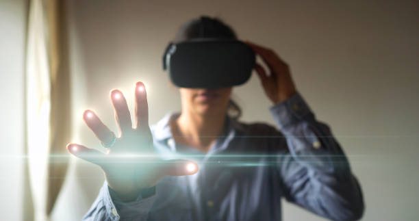 istock Portrait of an young man is using the futuristic latest innovation technology with augmented reality hologram. 1248892554