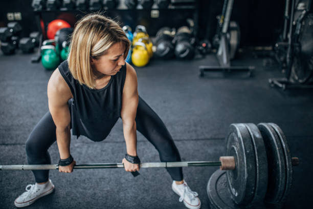 istock Healthy woman weightlifting 1248893844