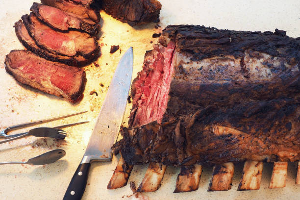 istock big whole prime rib cutting in small piece lay on plate 1248898200