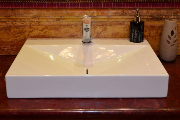 istock Bathroom sink with liquid soap and freshener 1248901655