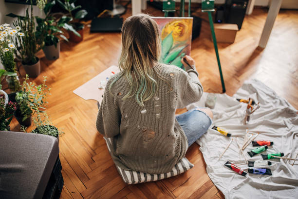 istock Woman painting on the floor 1248902578