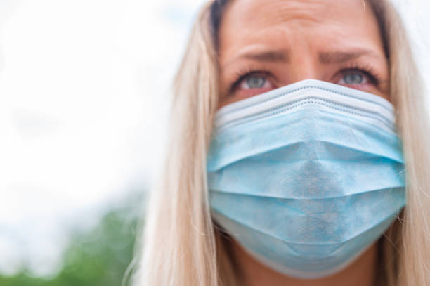 istock Young woman with protective face mask 1248903396