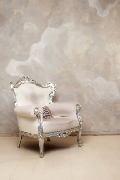 istock An antique white chair against wall 1248904987
