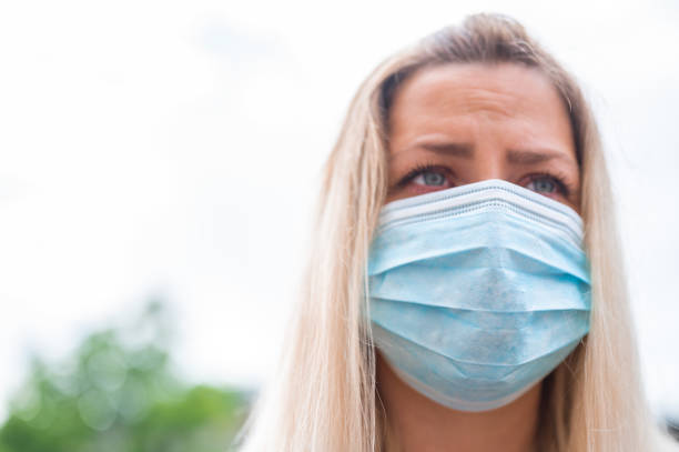 istock Young woman with protective face mask 1248906136