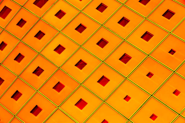 Glass exterior wall of modern building. Geometric lattice pattern.