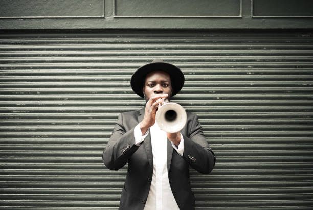 The trumpet player Trumpet, Player, vintage, face, art, jazz, trumpet player, close-up, music, fun, street, passion, city life, man trumpet stock pictures, royalty-free photos & images