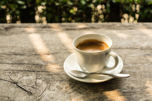 istock coffee cup on the wood table with sunlight 1248911564