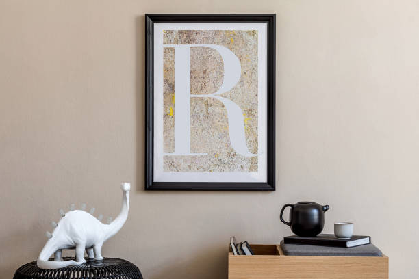 istock Modern scandinavian living room interior with black mock up poster frame, design commode, dino lamp, black rattan basket, teapot, books and elegant accessories. Template. 1248913803