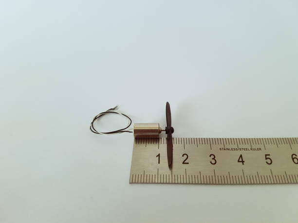 istock Micro Dc Motor and Micro Propeller Over The Stainless Steel Ruler 1248913850