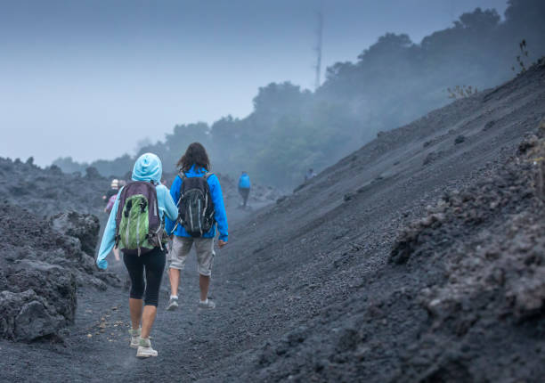 people at Pacaya volcano in Guatemala stock photo