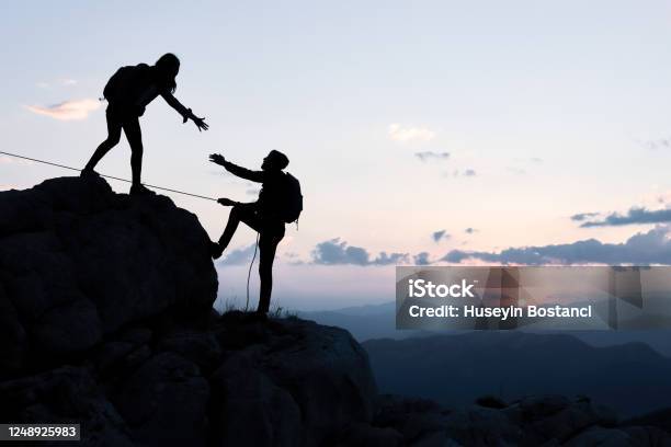 Supportextensionhelp And Human Being Stock Photo - Download Image Now - Adaptation - Concept, Climbing, Support