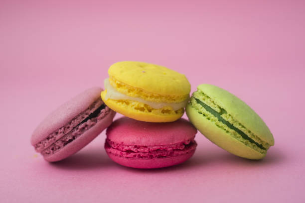 istock french traditional macarons on pink background 1248926062