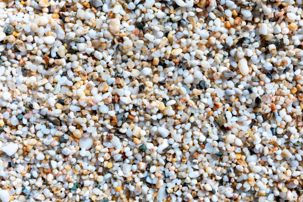 istock Small, round beach pebbles in warm color tones 1248927179