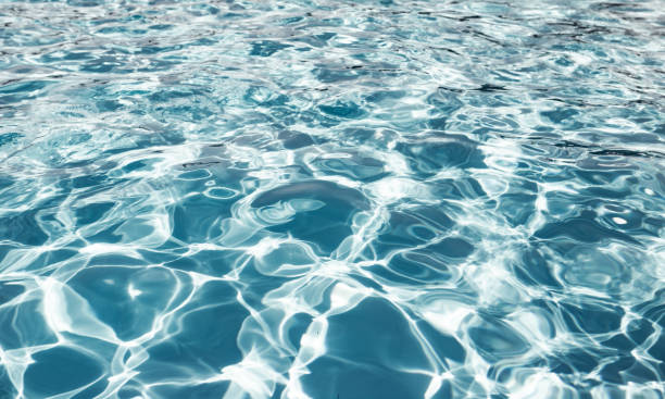 istock Clear shiny and warm blue water in the pool 1248930360