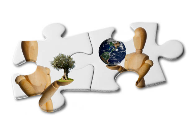istock A Wooden Doll Gives the World an Olive Tree 1248930442