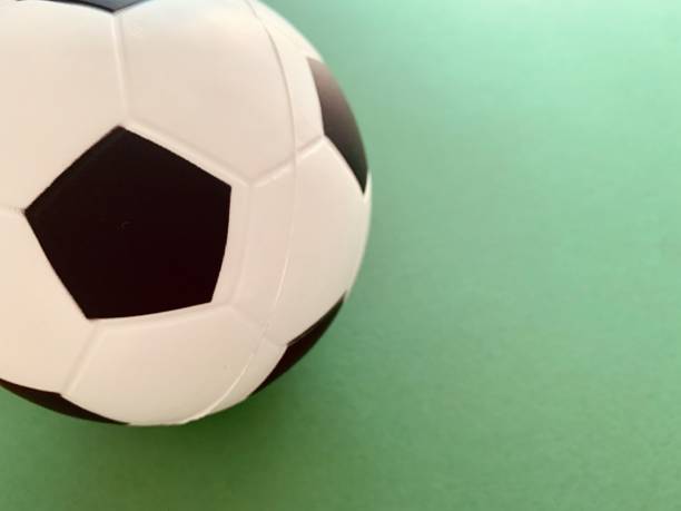 istock Football ball on green background 1248932835