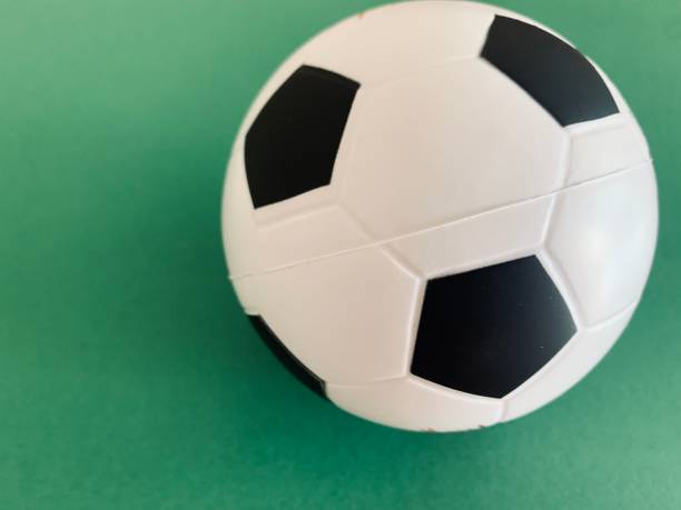 istock Football ball on green background 1248932887