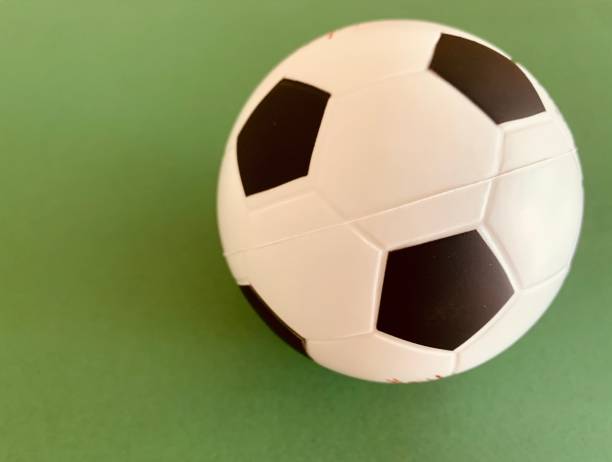 istock Football ball on green background 1248932902