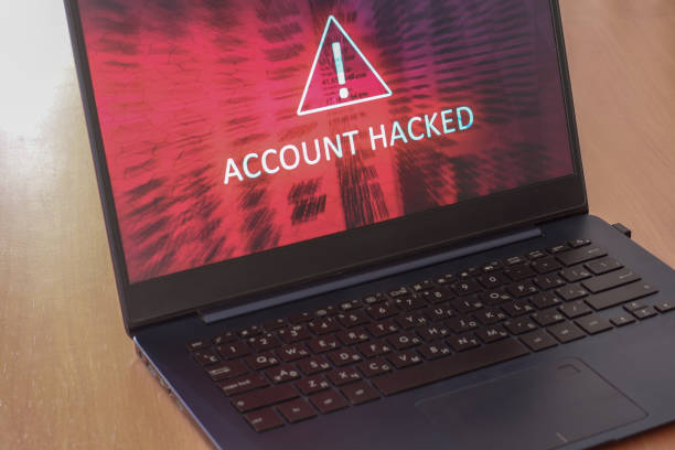 istock Hacked account concept on laptop screen with red background. Warning triangular sign with exclamation mark symbol. Horizontal. 1248933357