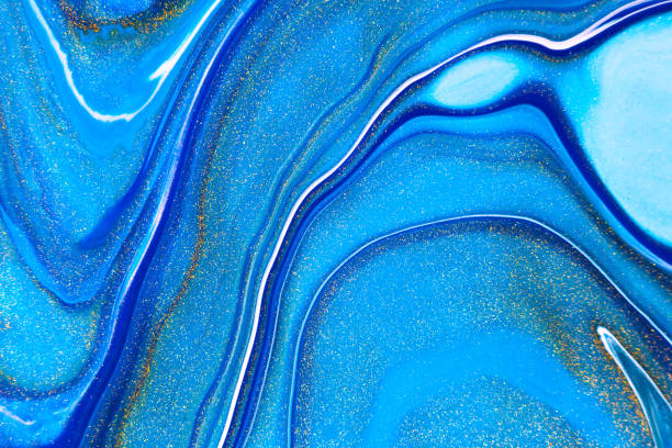 istock Fluid art texture. Abstract background with mixing paint effect. Liquid acrylic picture with flows and splashes. Mixed paints for background or poster. Navy blue, golden and azure overflowing colors. 1248934671