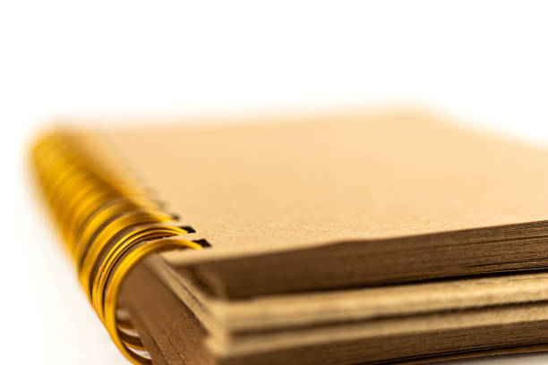 Extreme Close-Up Kraft notebook pages and spiral. Macro Photography Concept. Horizontal composition with copy space.