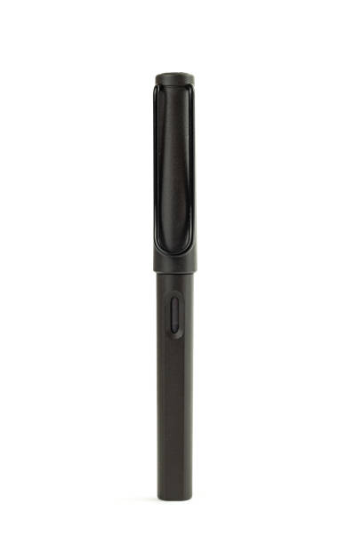 istock Black fountain pen standing on a white background 1248939315
