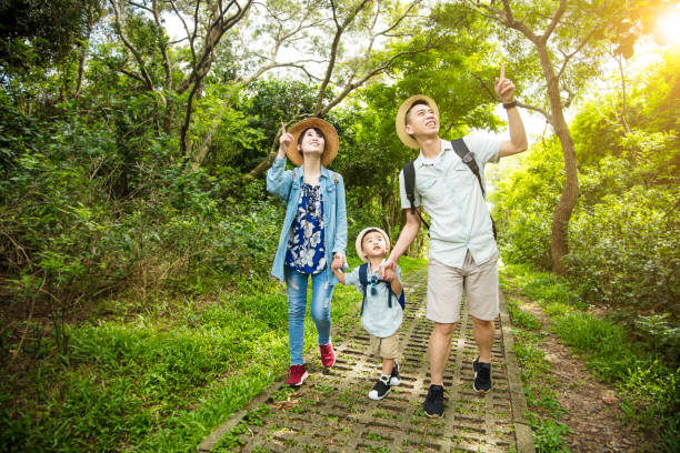 istock happy family hiking through the forest 1248941581