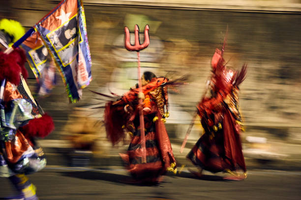 Two people with red devil costumes, backstage at Sambadrome parade in Rio de Janeiro, Brazil.