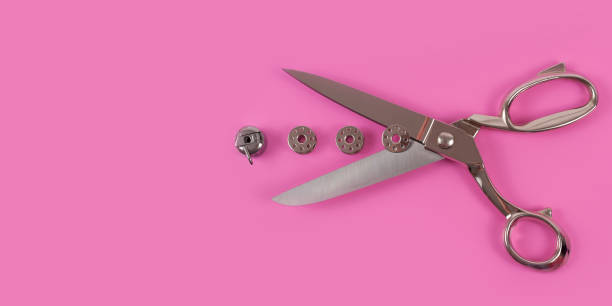 Accessories for sewing thread scissors needle and centimetre on a pink background Accessories for sewing thread scissors needle and centimetre on a pink background centimetre stock pictures, royalty-free photos & images