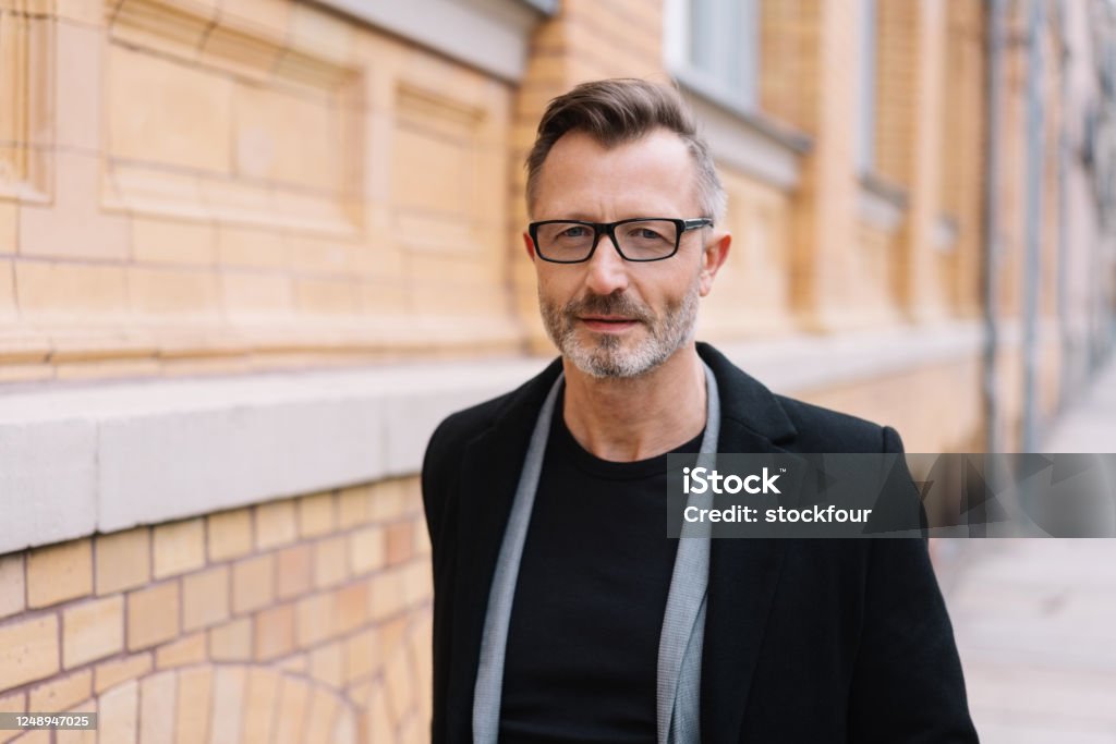 Portrait Of Mature Metro Man Walking On Street Stock Photo - Download Image  Now - 50-54 Years, 50-59 Years, Adult - iStock