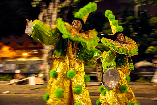 Nassau, Bahamas – December 26, 2022: The men in a traditional costume during a Junkanoo parade in the Bahamas.