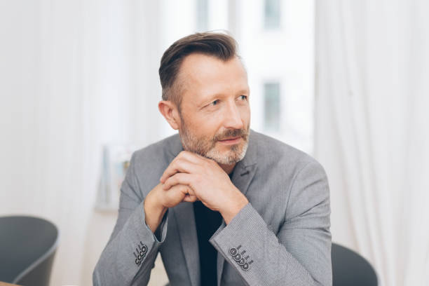 istock Portrait of mature man wearing grey jacket 1248948246