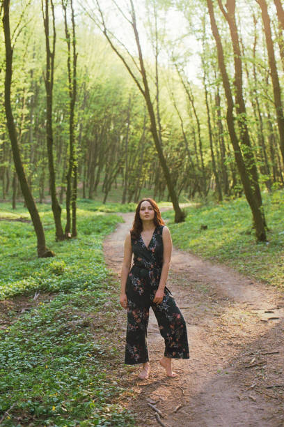 istock Woman walking in forest 1248949487