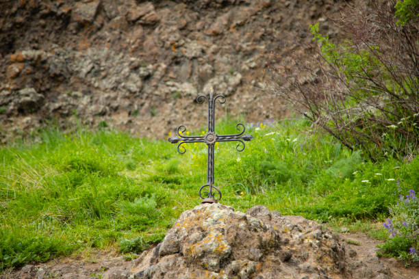 istock iron cross in mountain 1248949665