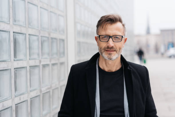 istock Serious middle-aged businessman in town 1248950709
